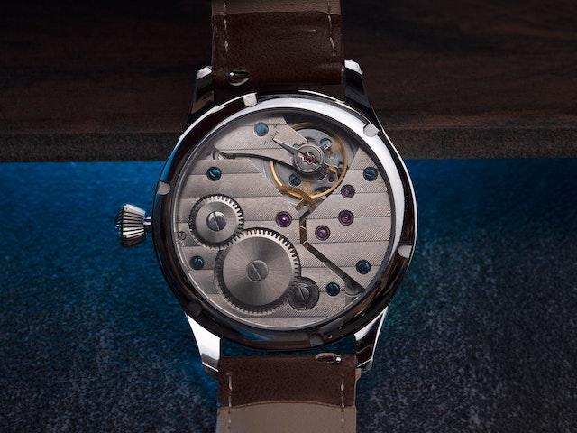 The backside of a watch showcasing the intricate mechanical movement