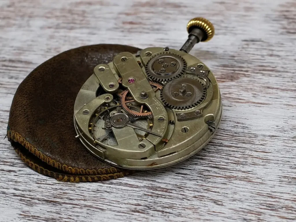 Close-up of a mechanical watch movement, showcasing intricate gears and components.