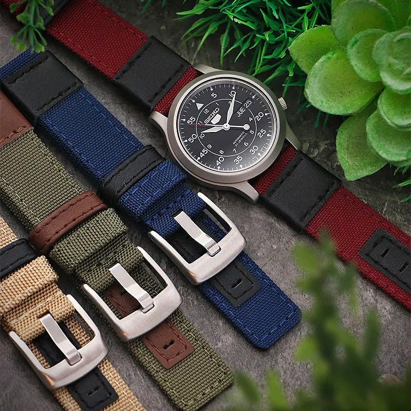 Four Canvas watch bands with red, blue, green, and beige colors