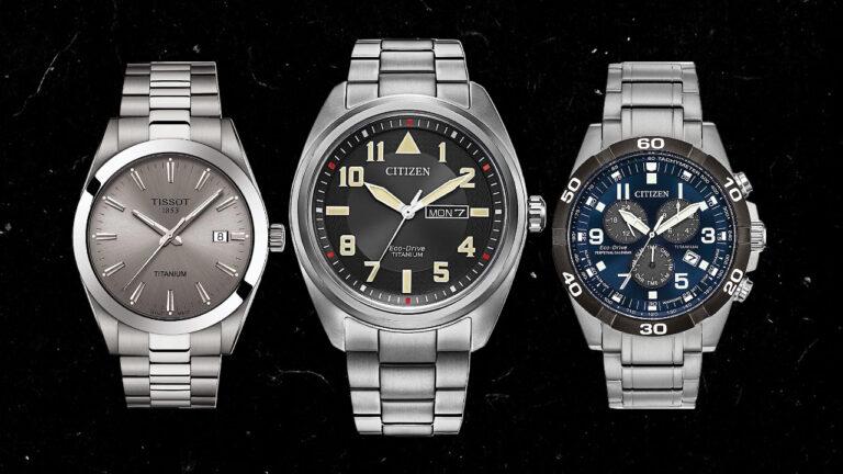 Three titanium wristwatches displayed against a black background: a Tissot with a titanium bracelet, a Citizen with large numeral indicators and date function, and a Citizen with a gray bezel.