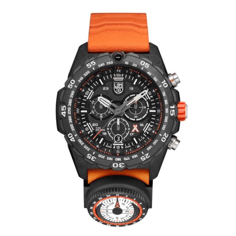 A black Luminox Bear Grylls Survival field watch with orange strap.