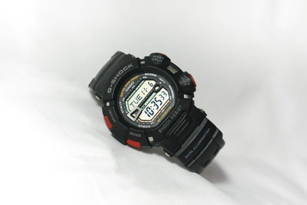 Close-up of a black Casio G-Shock digital watch with a black bezel and digital displays.