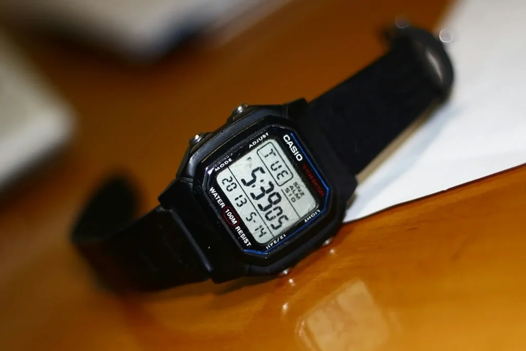 Close-up of a Casio watch with the scratched acrylic crystal