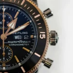 Close-up of a Breitling chronograph watch with three subdials and two pushers