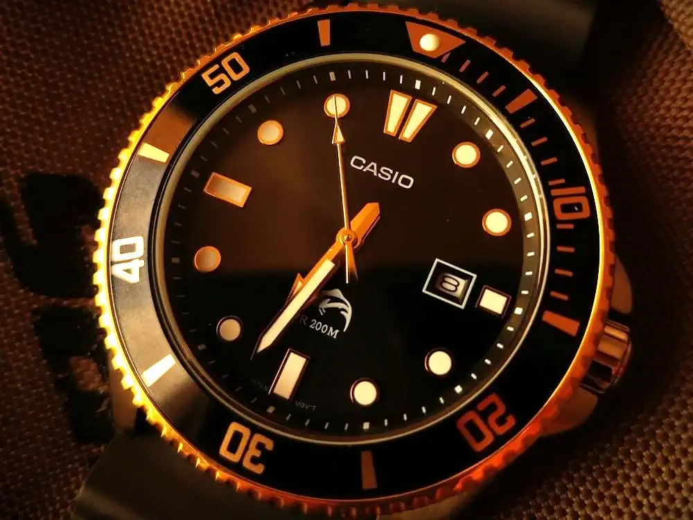 Close-up of a Casio Duro dial featuring luminous hands and indices