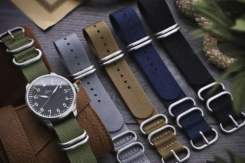 Five NATO straps with black, blue, beige, gray, green colors