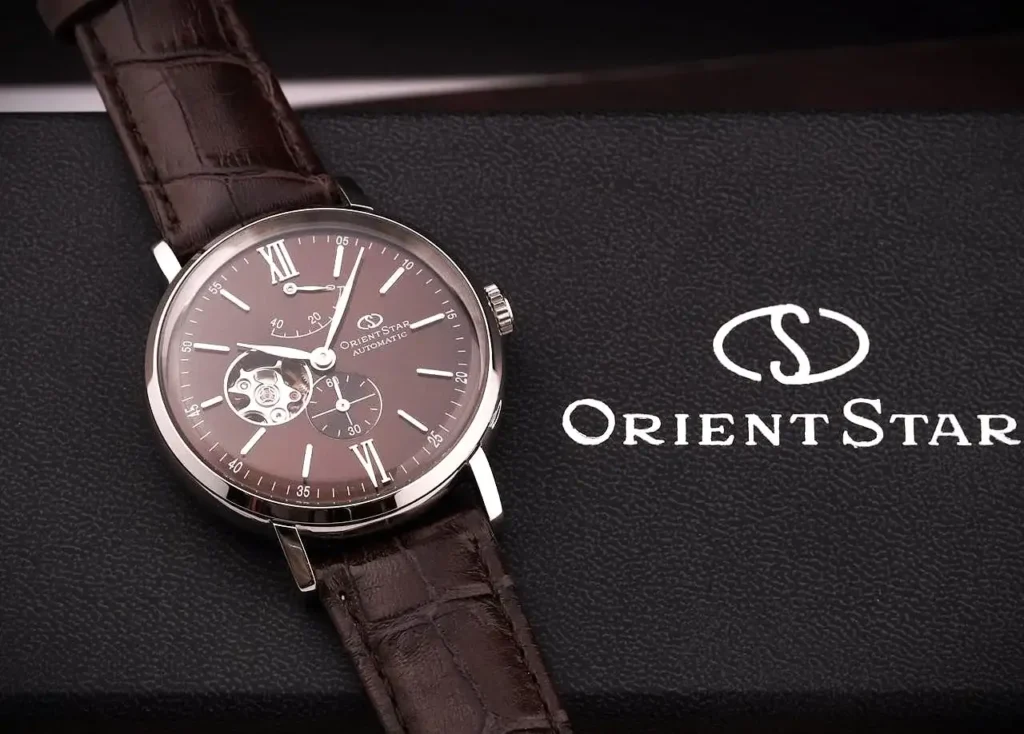 Close-up of the Orient Star featuring an open-heart dial and a brown leather strap