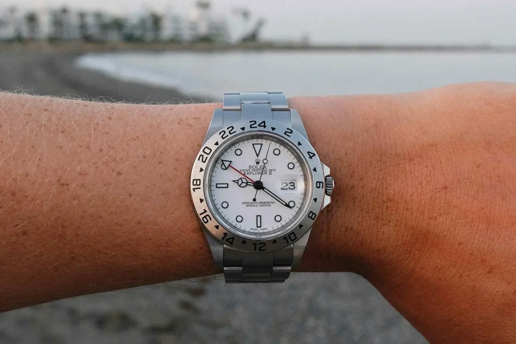 Close-up of a man's wrist wearing a Rolex Explorer GMT watch