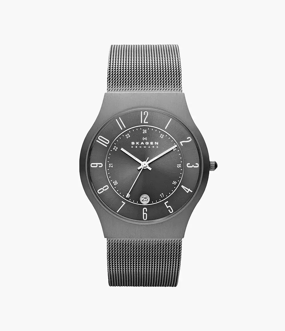 Close-up of a Skagen watch featuring a charcoal-colored dial and a mesh bracelet