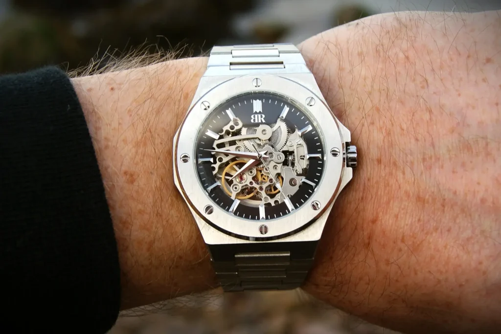 Close-up of a Bruder skeleton watch on a person's wrist.