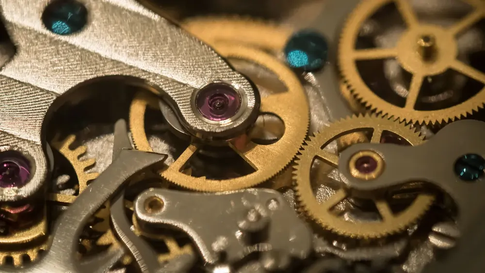 Close-up of the gear train in a mechanical watch movement.