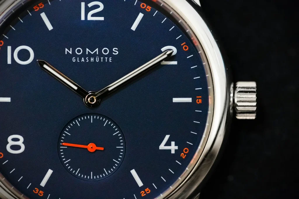 Close-up of a Nomos watch featuring a small sub-dial for seconds hand 