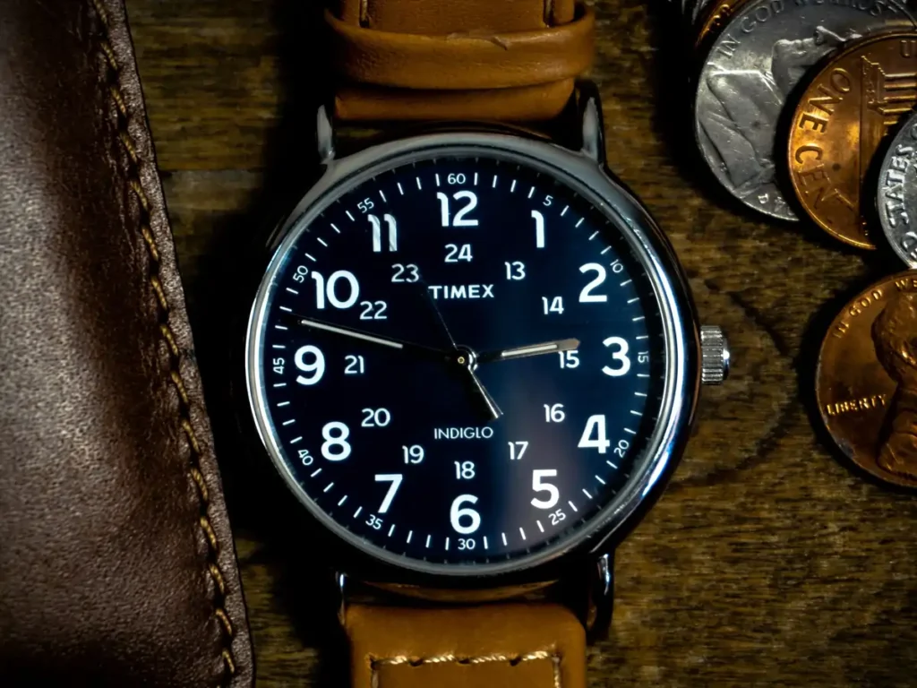 Close-up of a Timex Weekender watch with a vibrant blue dial and bold Arabic numerals.