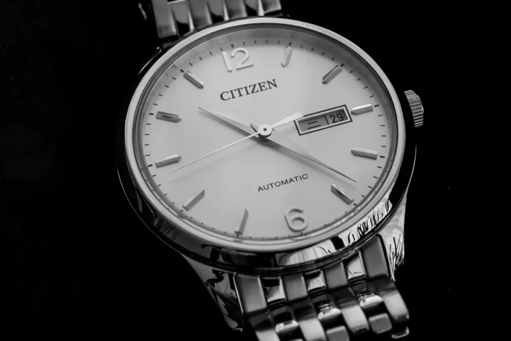 Close-up of a Citizen automatic dress watch, showcasing its affordable elegance.