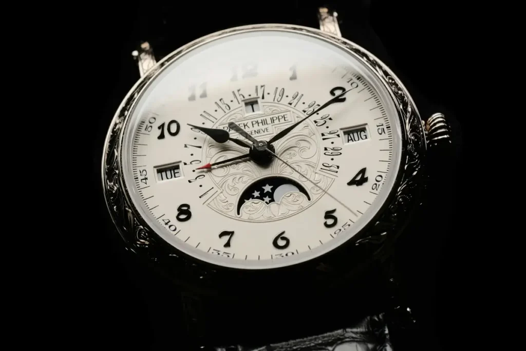 Close-up of a Patek Philippe Moon Phase watch, showcasing its intricate complications and elegant design.