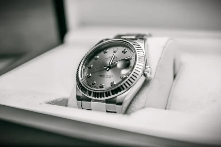 Close-up of a Rolex Oyster Perpetual Datejust dress watch elegantly placed in its box.